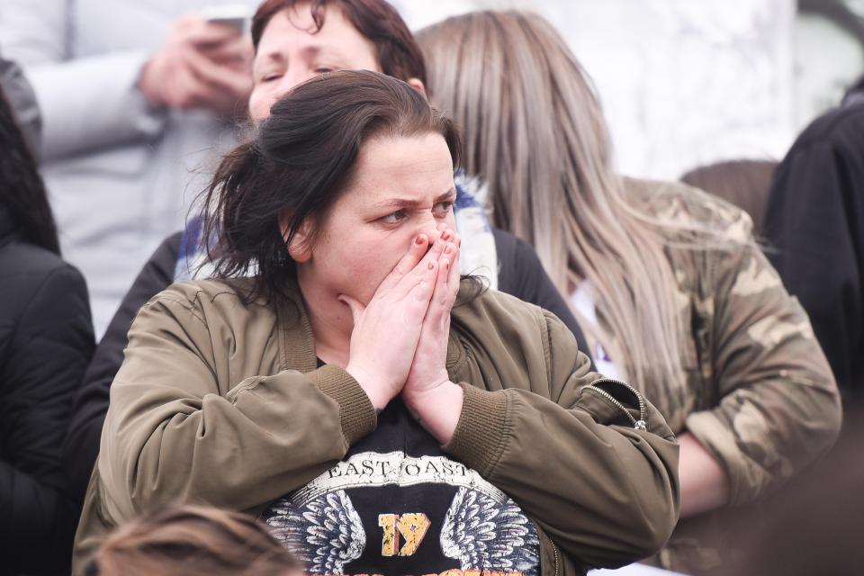 A woman reacts to the news that Alfie's parents' appeal has been dismissed 