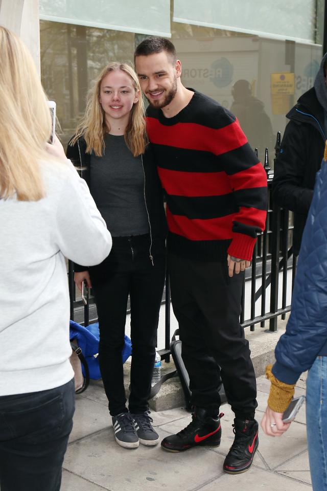  Liam posed happily with fans