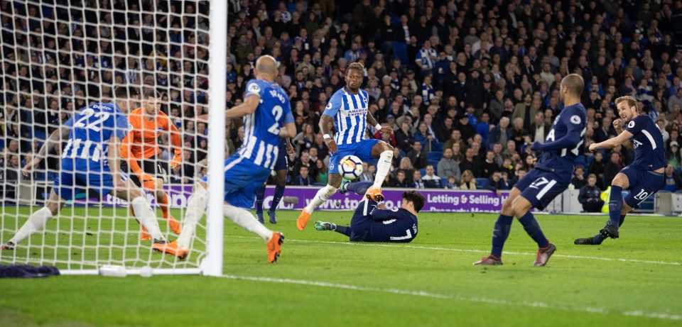  Harry Kane's strike hit off Brighton defender Bruno before going in