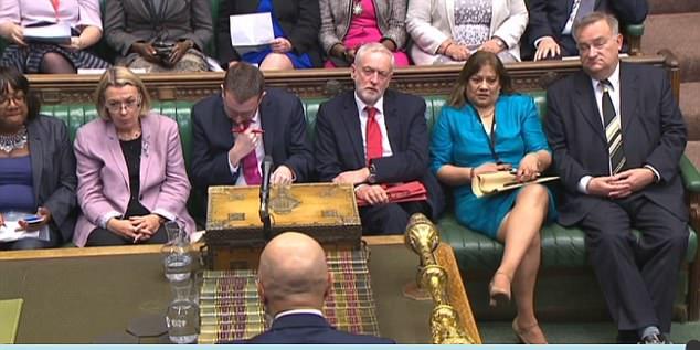  Jeremy Corbyn sits on the opposite bench during questioning in the House of Commons