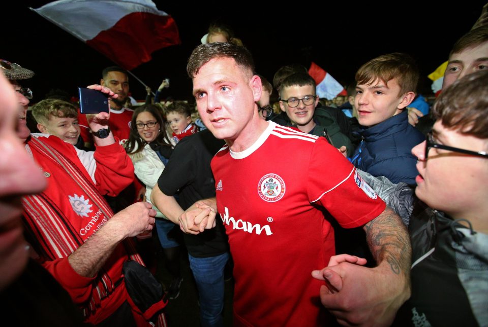  Billy Kee is mobbed by supporters at the Crown Ground