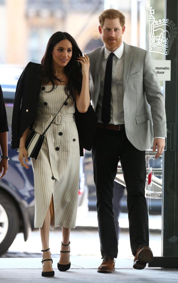  Meghan Markle dressed to impress in a £1,400 frock today