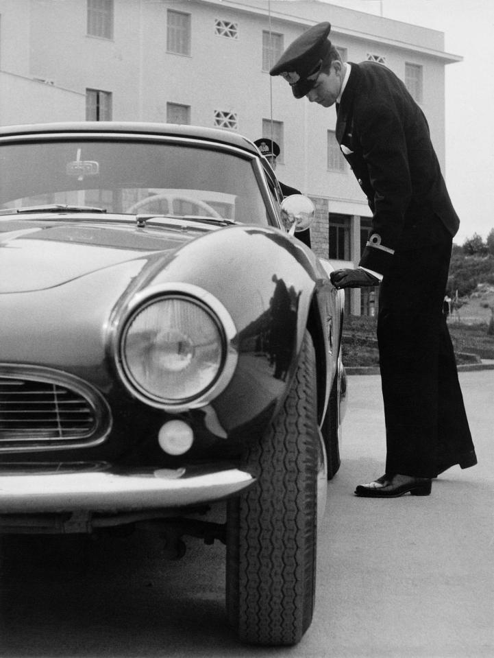  The then Prince is pictured getting into his BMW 507 Roadster