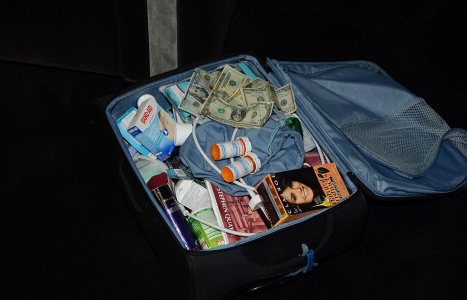 This shot shows a packed suitcase belonging to Prince 