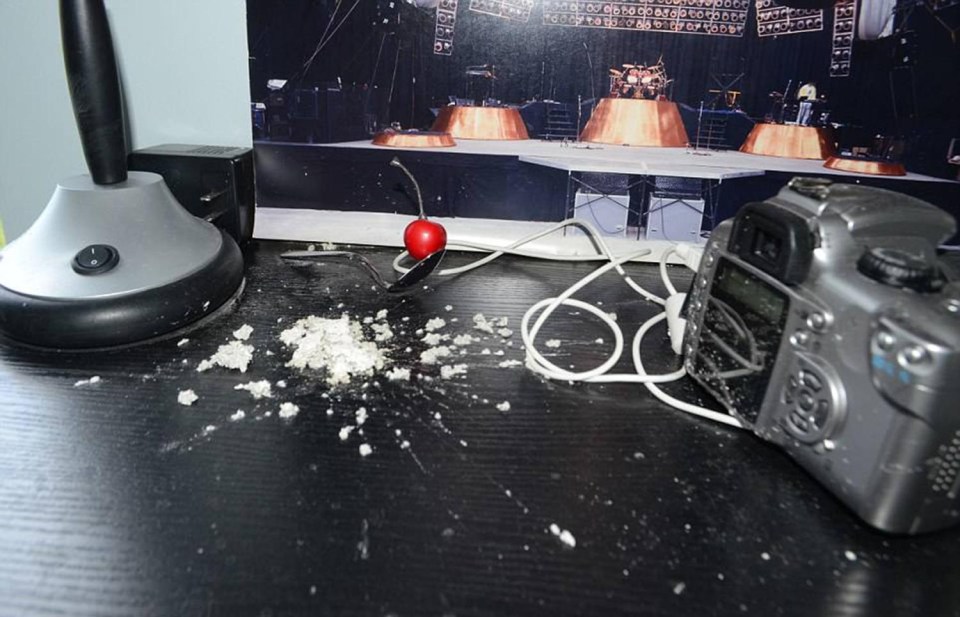 White powder is scattered across a desk in his home 