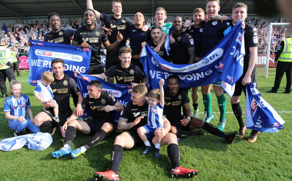  Some of the Wigan players brought their families on the pitch to celebrate