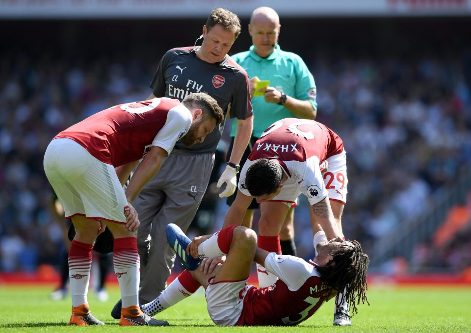 Elneny was clearly in agony after being injured in a challenge for a bouncing ball on the edge of the box