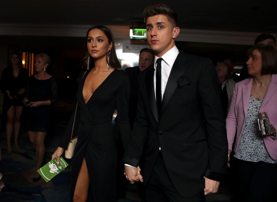  Fulham skipper Tom Cairney arrives with his partner