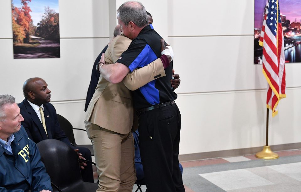  Waffle House President and CEO Walt Ehmer embraces James Shaw