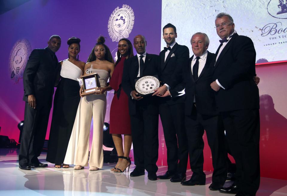  Family members of Cyrille Regis collect his PFA Merit Award