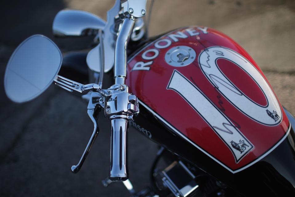  An autographed Wayne Rooney 'shirt' covers the petrol tank