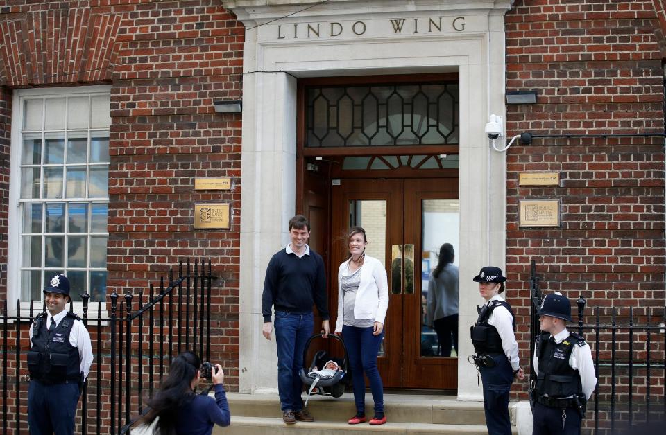  The pair were flanked by police officers who have been stationed outside St. Mary's Hospital in London