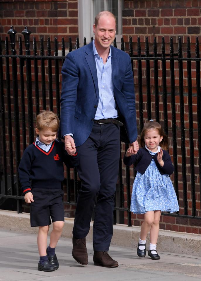  Earlier, Prince William smiles as he takes his children in to meet their new baby brother