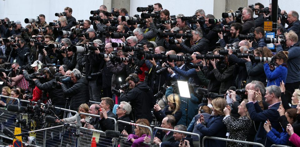  Throngs of photographers and reporters line up outside the hospital to take the precious first photos of the royal baby