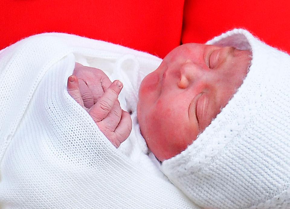  The rosy-cheeked tot was carried out by proud Wills and Kate