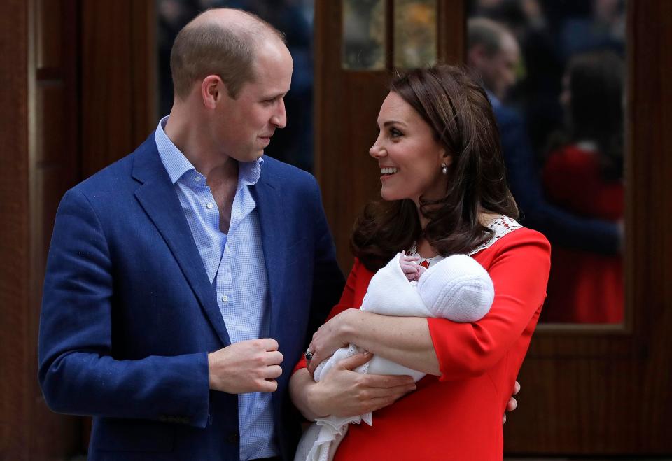  The beaming parents showed off their third baby in front of well-wishers yesterday