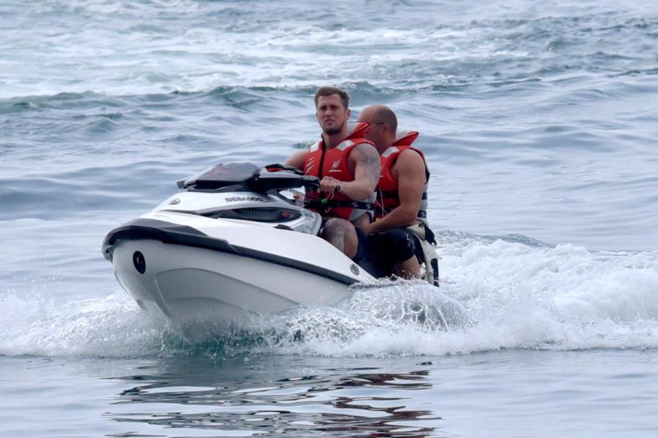  Dan and a pal have some fun on a jet ski during the retreat