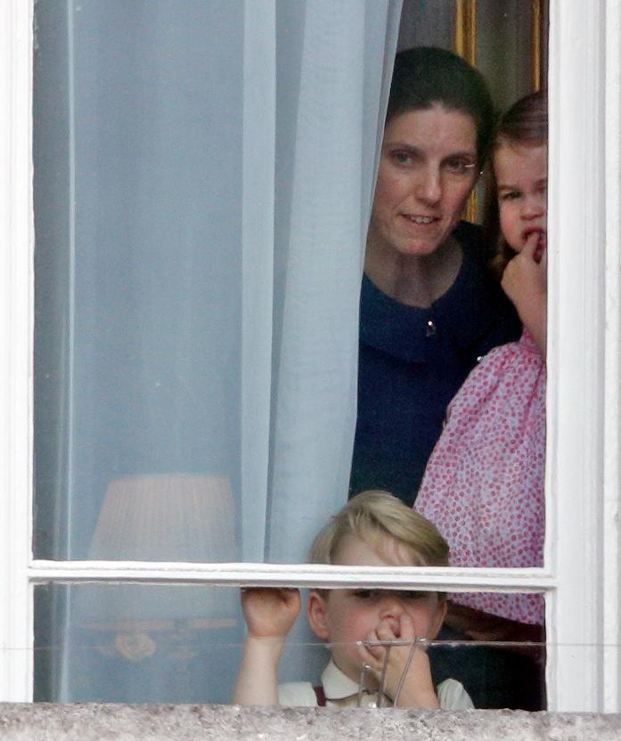  The cheeky royal kids peek through the window of Buckingham Palace with nanny Maria Teresa Borrallo