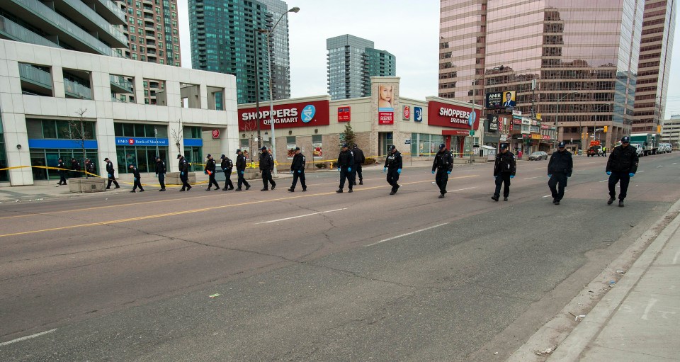 Yonge Street remained cordoned off as Toronto police continued to search for evidence 