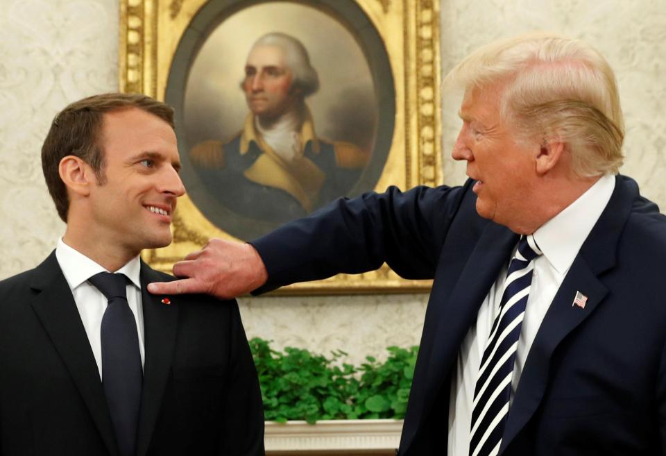  Donald Trump wipes dandruff from Macron's jacket during last week's love-in