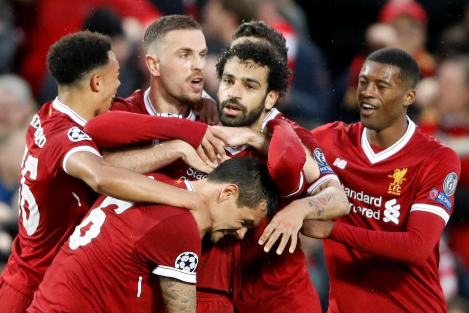  Egyptian star Salah is mobbed after scoring goal number 42 of an astonishing season