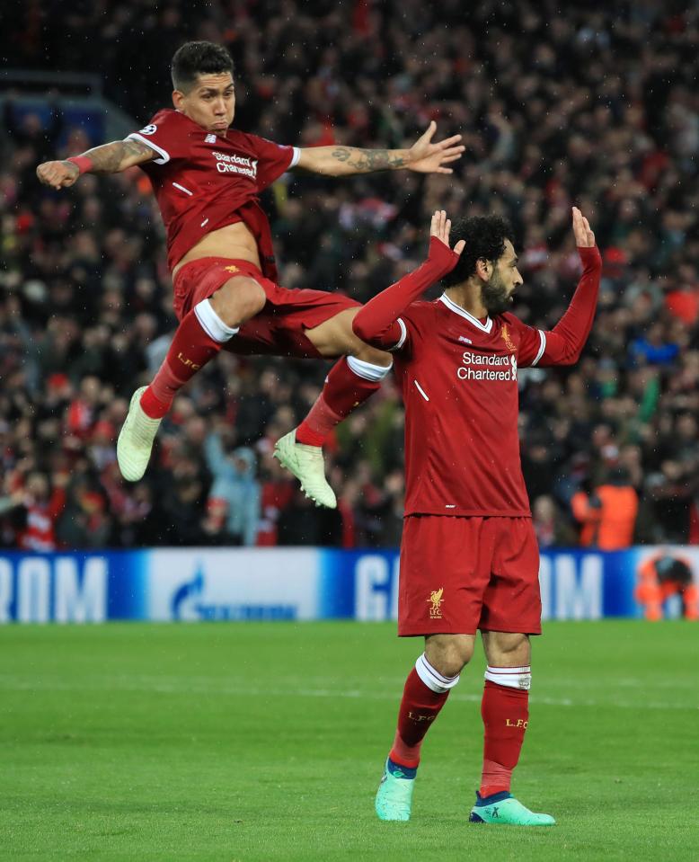  A delighted Roberto Firmino is the first on the scene to celebrate with Salah