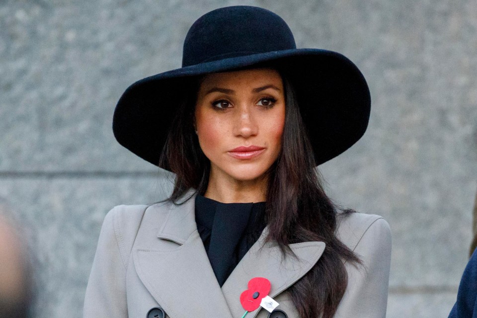 Meghan wore a sombre grey coat and wide-brimmed hat for the commemorative service