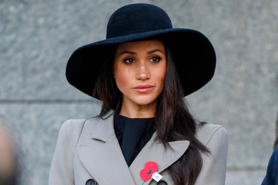  Meghan wore a sombre grey coat and wide-brimmed hat for the commemorative service