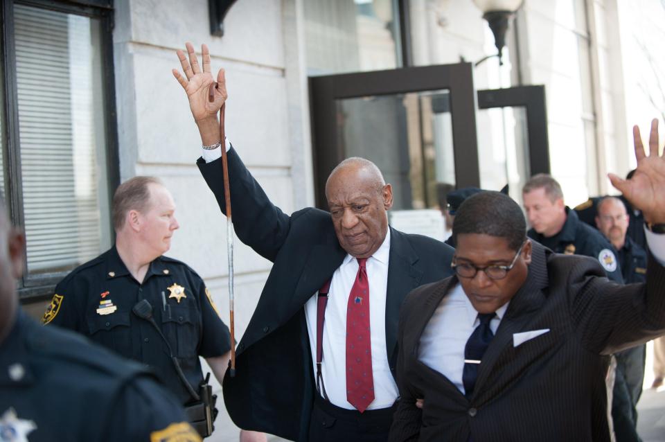  US comedian Bill Cosby leaves court with his hand raised after being found guilty of sexual assaulting a woman 14 years ago