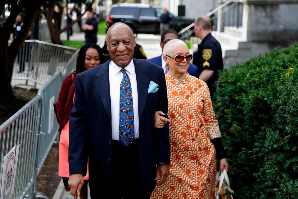  Cosby, left, with his wife, Camille, right, entering the court house earlier this week