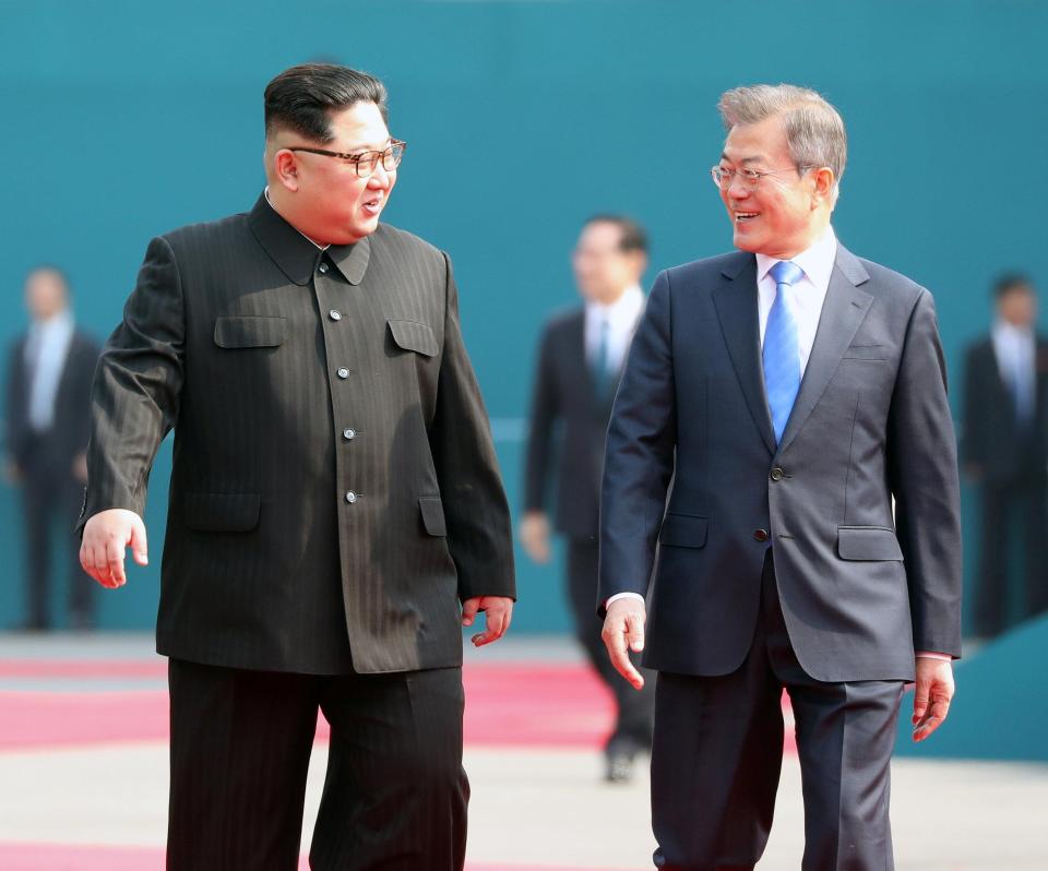  The pair laughed as they walked together ahead of peace talks on Friday