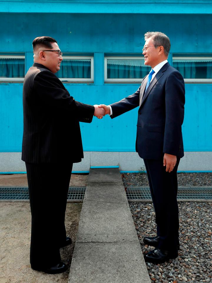  Kim Jong-Un and Moon Jae-In's historic handshake across the Korean border