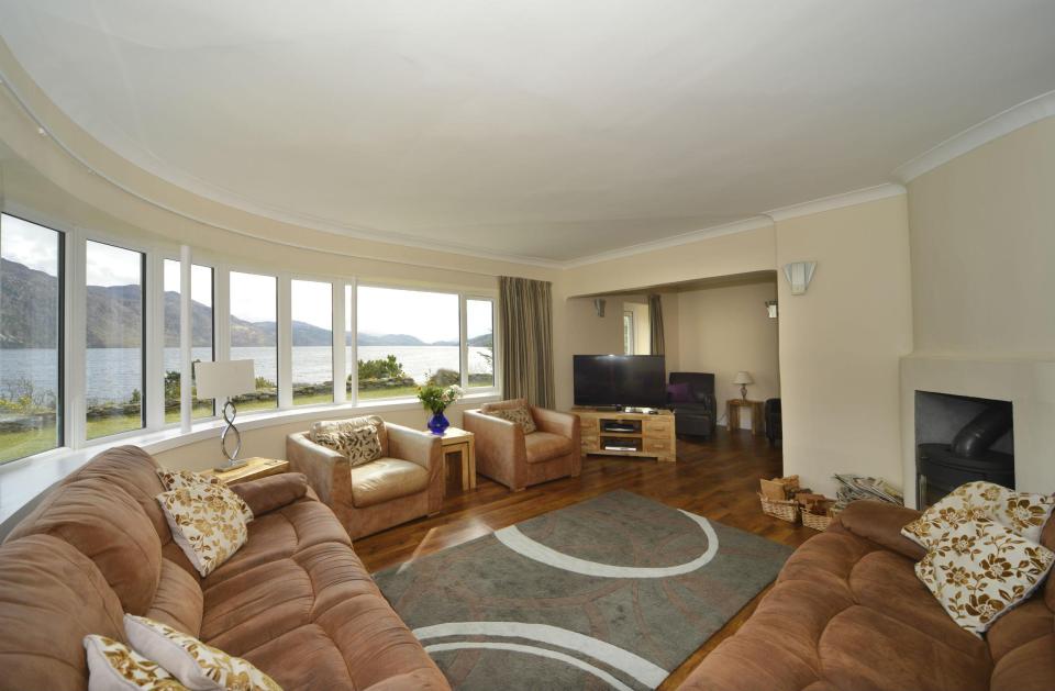  The living room boasts enviable views of the iconic lake