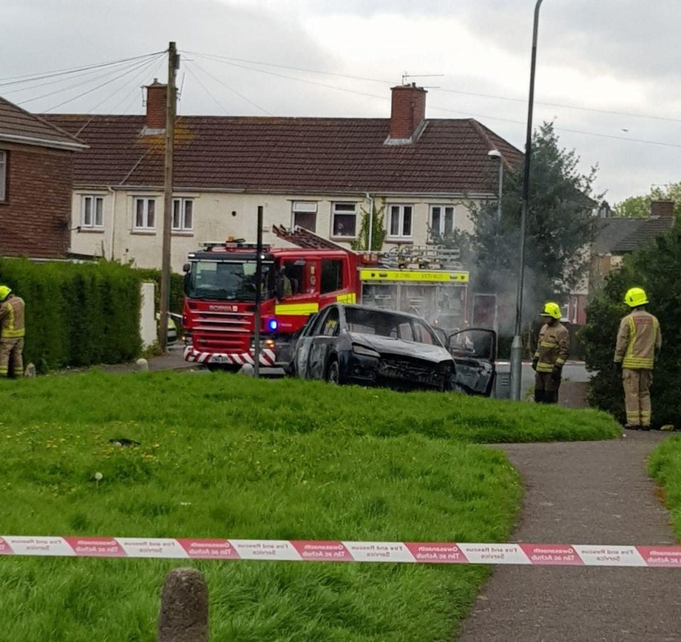  The car involved in the smash is seen burnt out as cops hunt the driver