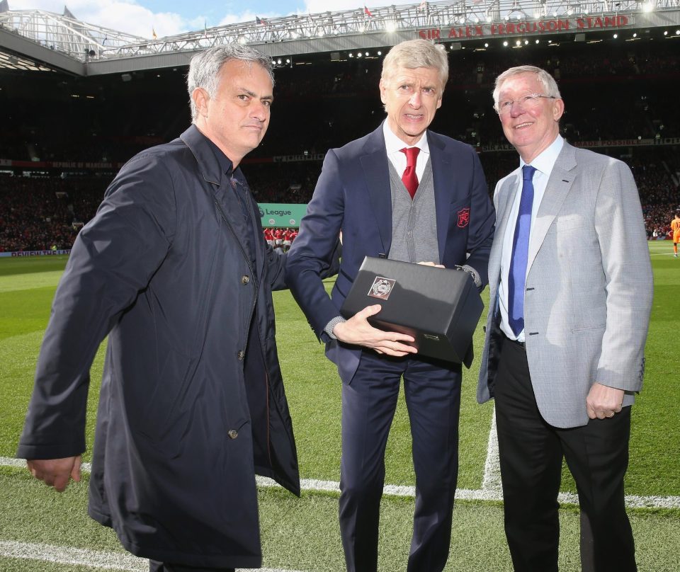  Arseen Wenger picks up a vase and warm words from old rivals Jose Mourinho and Alex Ferguson