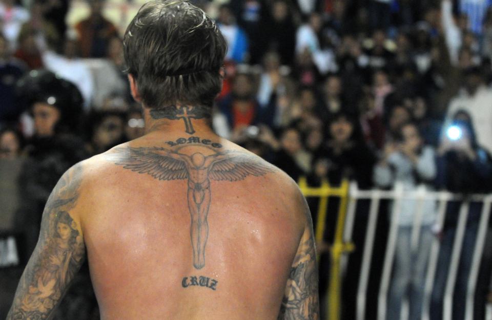  His first tattoo was his son's name on his lower back followed up by the guardian angel between his shoulder blades