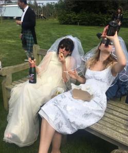  Lily James and her friend Emma Freud wore wedding dresses and swigged prosecco out the bottle as they watched the Royal Wedding