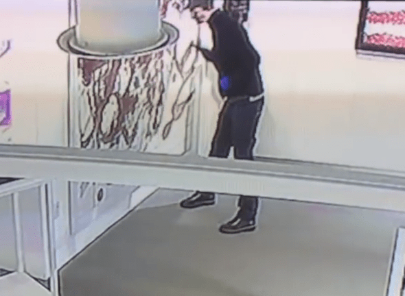  A man was caught on camera slashing the painting with a razor blade