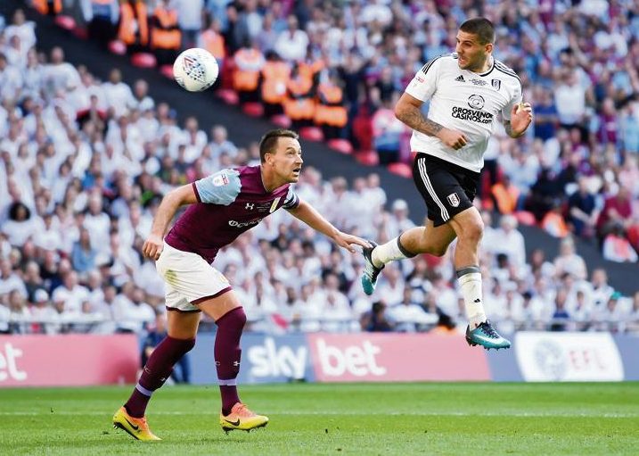 Defensive legend John Terry leaps with Fulham's striking star Fulham's Aleksandar Mitrovic