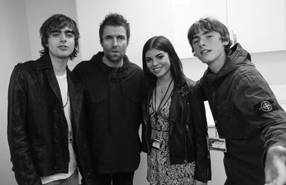 Liam Gallagher has finally met his daughter Molly. She posed with him and his sons Lennon and Gene at his gig last night