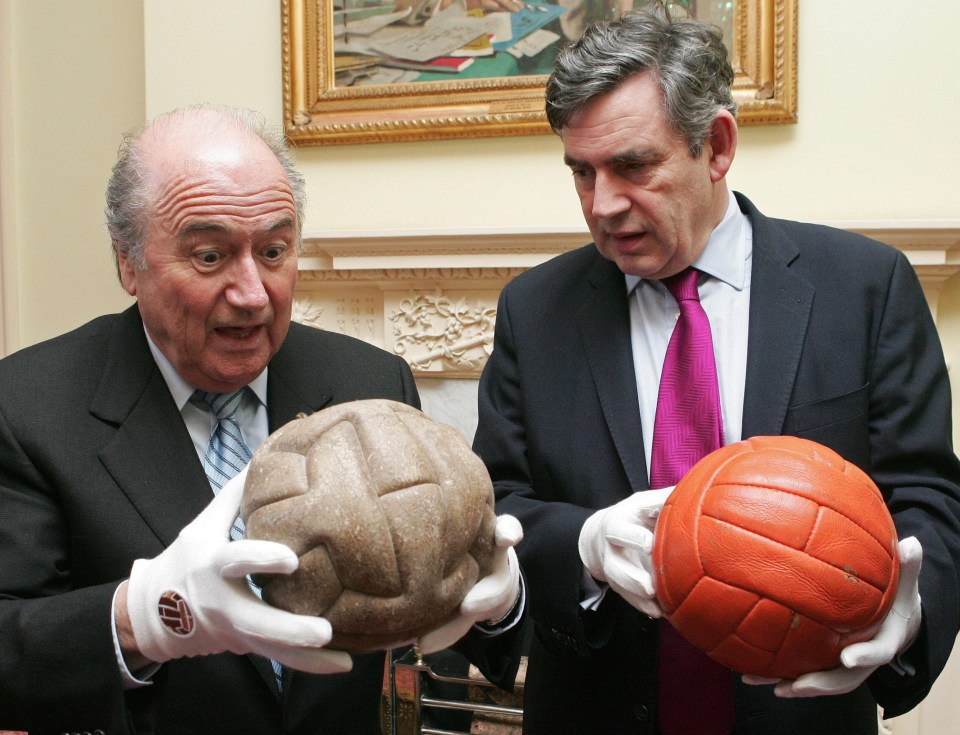 Ex-Fifa president Sepp Blatter and British Chancellor Gordon Brown hold the respective 1930 and 1966 World Cup balls