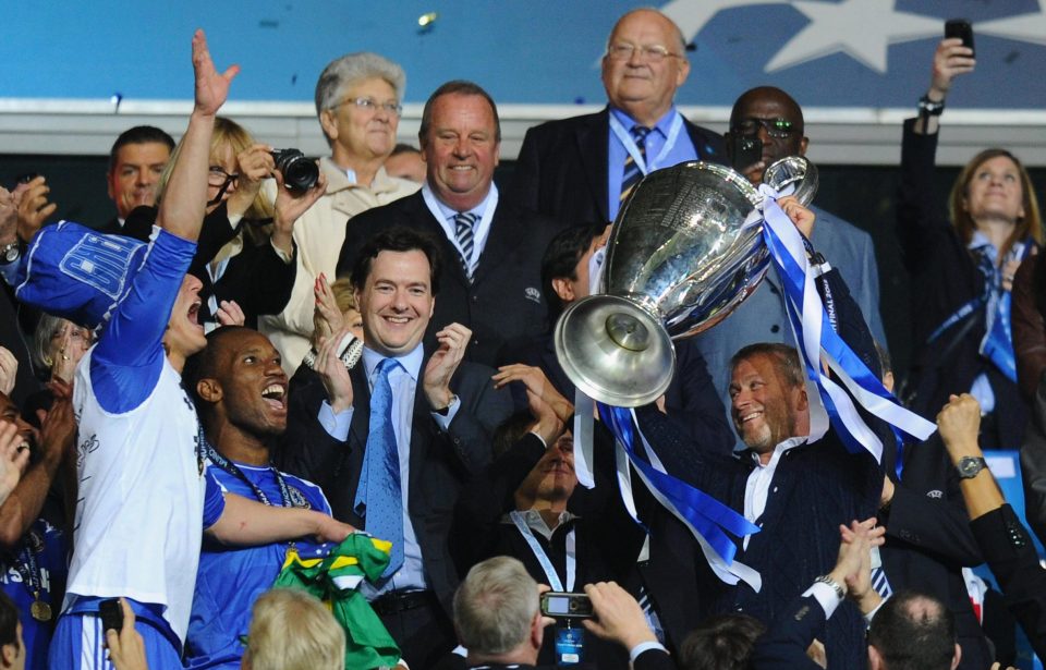  The Chelsea owner holds the Champions League trophy after his team won in 2012