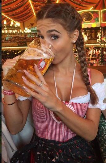  German midfielder Mario Gotze's girlfriend Ann-Kathrin Brommel reminds the lads they can have a drink before they go to bed... alone