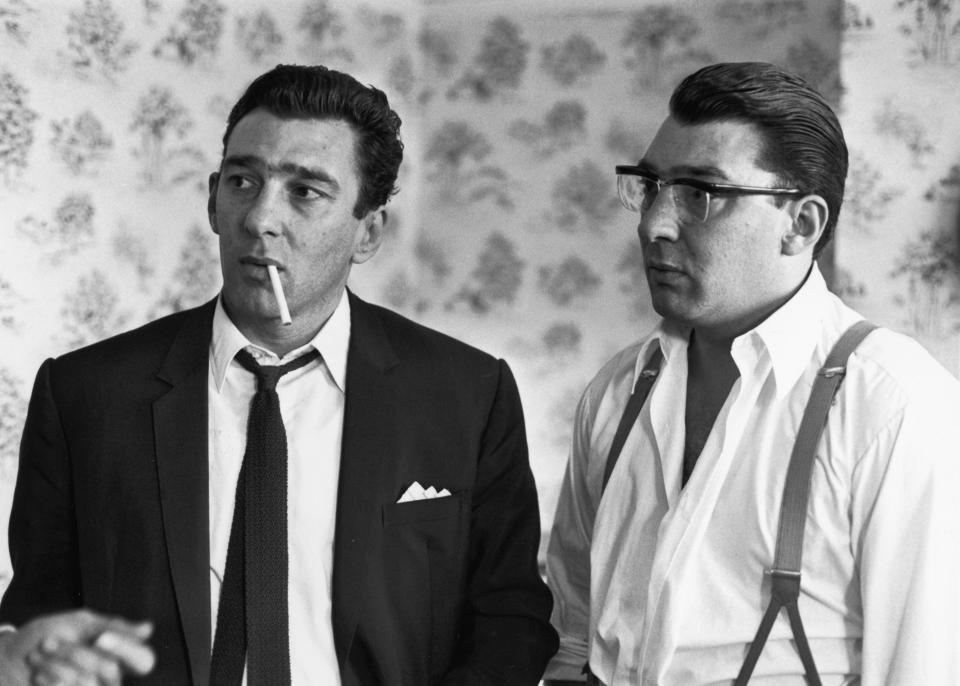  Ronnie, right, and Reggie Kray were pals of Foreman's and The Firm, as their gang was known, ruled the dark streets of East London