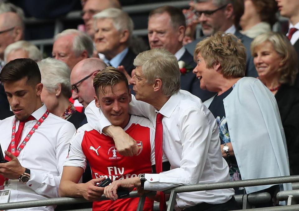  Ozil and Wenger celebrate winning the FA Cup last season