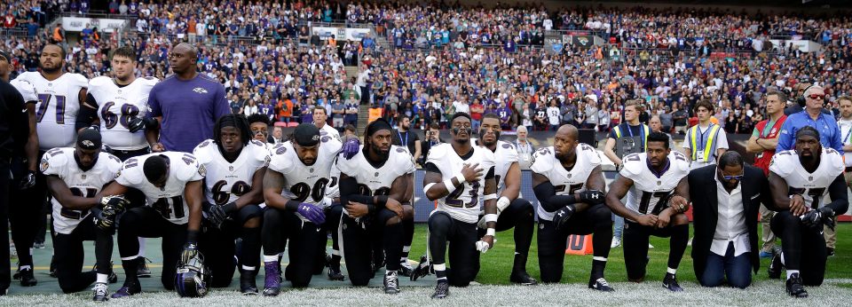  Baltimore Ravens players kneel during a rendition of ' The Star-Spangled Banner' before their game against the Jacksonville Jaguars at Wembley last year