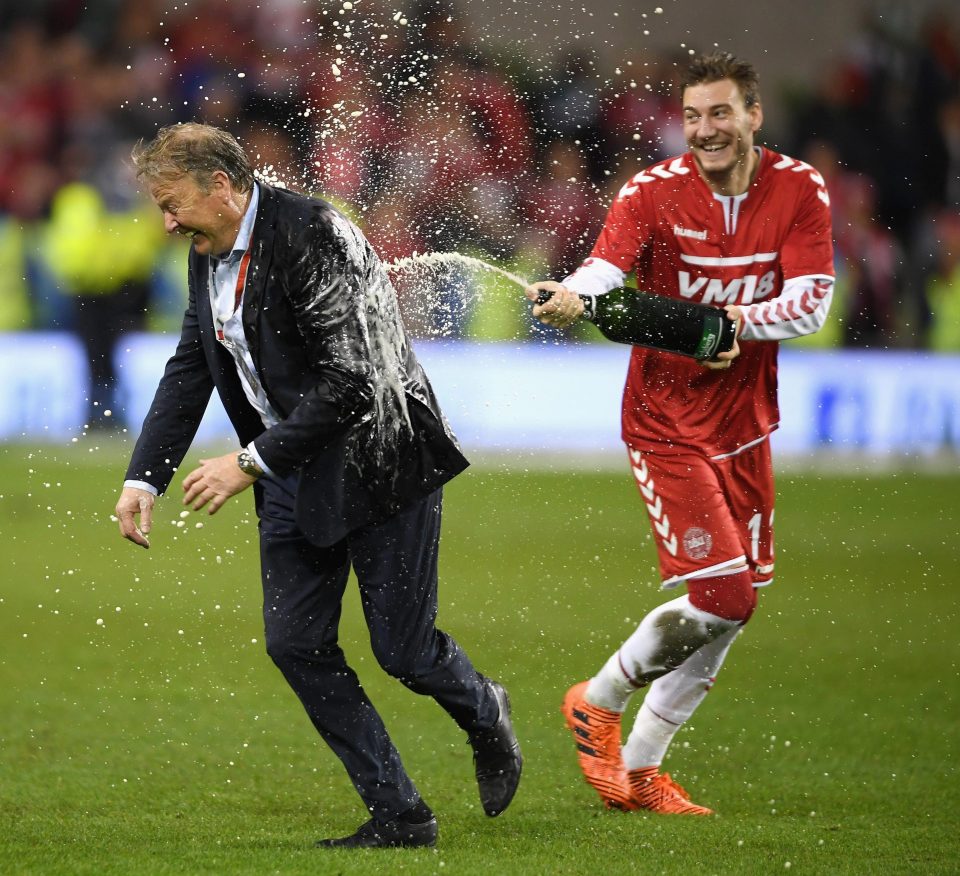  Nicklas Bendtner of Denmark sprays manager Aage Hareide with champagne