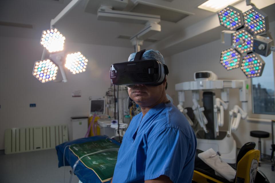  A surgeon wears a VR headset inside an operating theatre