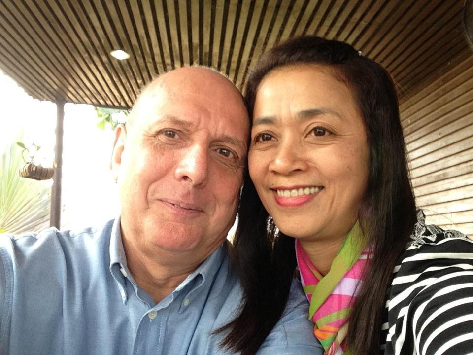  John Toms is pictured with his Thai wife Thanyaporn Donsakul