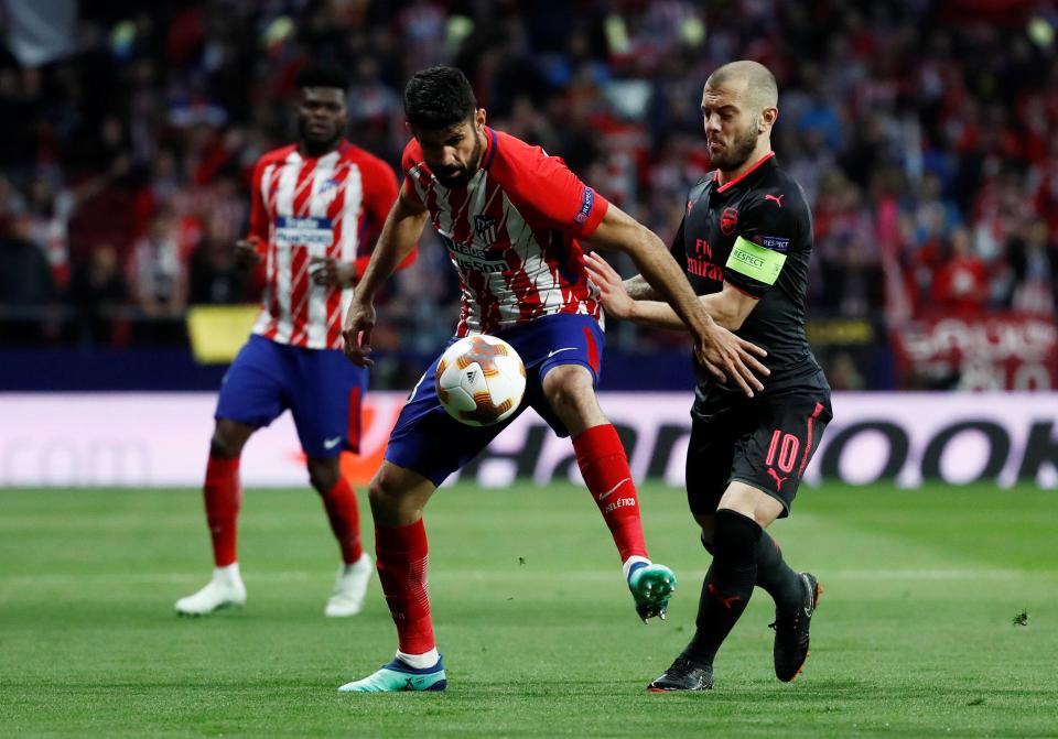  Jack Wilshere marshalls Diego Costa during Europa League semi-final